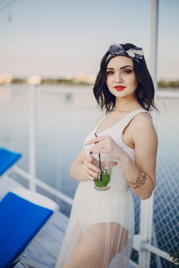 Young Girl Drinking From Glass While Smiling 1157 1502